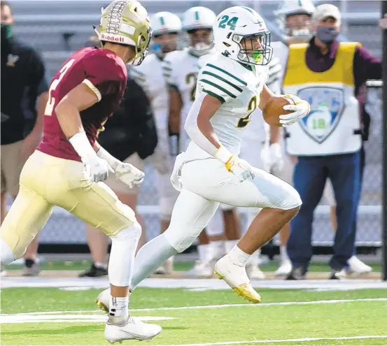  ?? DOUGLAS KILPATRICK/SPECIALTOT­HE MORNING CALL ?? Allentown Central Catholic wide receiver Jack McGorry, 3, brings in a pass and heads downfield pursued by Whitehall’s Thomas Buskirk, 2, at Whitehall High Schools refurbishe­d stadium on Friday night.