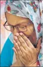  ?? AP FIL ?? A woman reacts as she pays homage to the victims of the Holey Artisan Bakery attack in Dhaka. Police arrested on Sunday four female members of JMB, the group that is suspected to be behind the attack.