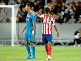  ??  ?? Juventus' Cristiano Ronaldo and Atletico Madrid's Joao Felix