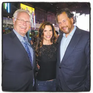  ?? Catherine Bigelow / Special to The Chronicle ?? UCSF Benioff Children’s Hospital CEO Mark Laret (left), Lynne Benioff and her husband, Salesforce founder Marc Benioff, at the Dreamforce Concert for the Kids at Pier 70 in S.F.