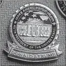  ?? [BILL O’LEARY/THE WASHINGTON POST] ?? President Donald Trump’s presidenti­al challenge coin is bigger than his predecesso­rs’ coins, is gold rather than copper or silver and has a more personal design.