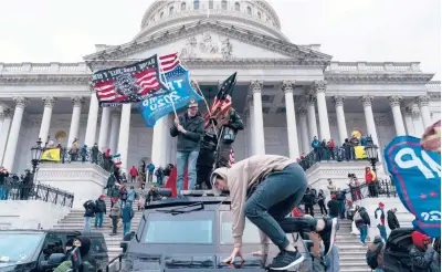  ?? ALEX EDELMAN/GETTY ?? Supporters of President Trump seen Wednesday outside the U.S. Capitol in Washington, D.C.