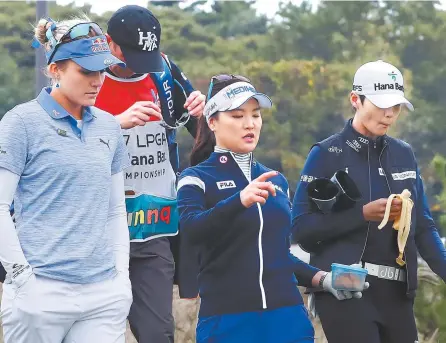  ??  ?? Lexi Thompson of the United States, left, and Ryu So-yeon, center, and Park Sung-hyun of South Korea walk side by side during the first round of the LPGA KEB Han Bank Championsh­ip at the Ocean Course at the Sky 72 Golf & Resort in Incheon, Thursday....