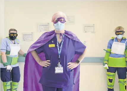 ??  ?? Valuable experience Beatson staff Leigh Anne Coia, Donna Kelly and Nicky Donnelly with the dementia suits