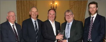  ??  ?? From left: Andrew Nolan (County Treasurer), Thos. Ryan (committee), Derek Kent (County Chairman), Tom Rossiter of Glynn-Barntown (hall of fame inductee), Gearóid Devitt (County Secretary).