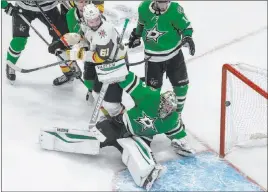  ?? Jason Franson The Associated Press ?? Dallas goalie Anton Khudobin can’t make the save as Golden Knights’ Mark Stone fights through some traffic from the side of the net. The Stars won Thursday 3-2 in overtime to take a 2-1 series lead in the Western Conference final.