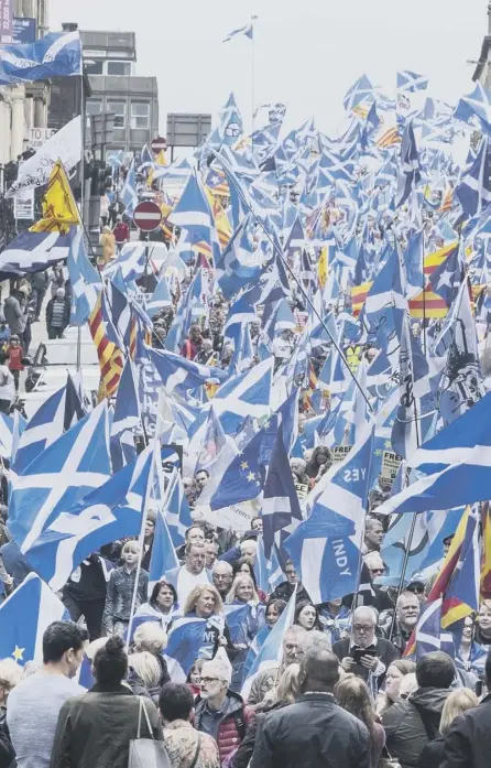  ??  ?? 2 An All Under One Banner rally in Glasgow is a sea of Saltires but Pamela Nash says the flag is not only a nationalis­t symbol, unionists can fly it too