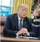  ?? [AP PHOTO] ?? President Donald Trump talks on the phone with Mexican President Enrique Pena Nieto in the Oval Office of the White House on Monday in Washington. Trump is announcing a trade “understand­ing” with Mexico that could lead to an overhaul of the North American Free Trade Agreement.