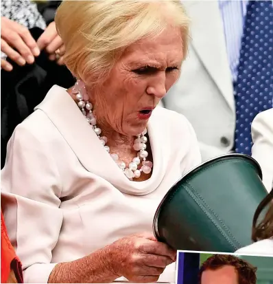  ??  ?? Choc horror! Mary Berry peers into the sweet bucket