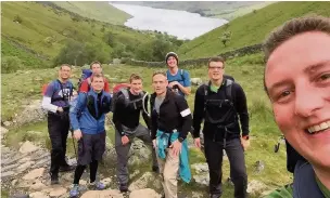 ??  ?? ●● The staff at facilities firm Sodexo scaled the three largest mountains in the UK within 24 hours to raise money for Seashell Trust