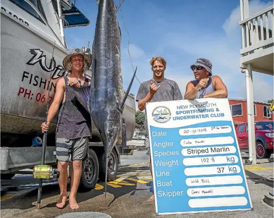  ?? PHOTO: GRANT MATTHEW/STUFF ?? On Saturday Caleb Moratti, left, reeled in the first marlin to be caught off the Taranaki coast this season while fishing with Joel Clegg and his father and boat skipper Gary Moratti