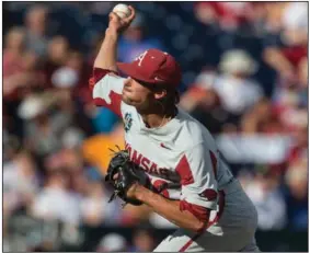  ??  ?? Arkansas’ Blaine Knight pitches against Oregon State in Game 1 of the College World Series finals on June 26, 2018, at TD Ameritrade Park in Omaha, Neb. Knight allowed seven hits in a 4-1 victory that wrapped up his 14-0 season.
(NWA Democrat-Gazette/Ben Goff)