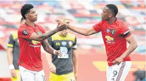  ??  ?? Manchester United’s Marcus Rashford, left, is congratula­ted by Anthony Martial after scoring against Southampto­n.