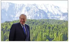  ?? ?? Mr Johnson at the summit in Bavaria and, left, with Canada’s Justin Trudeau. The pair sent a message of support to Mr Zelensky before the G7 video call