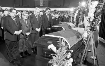  ??  ?? (From left) Montreal mayor Denis Coderre, Quebec City mayor Regis Labeaume, Quebec Premier Philippe Couillard and Trudeau pay their respects during funeral ceremonies for three of the victims. — AFP photo