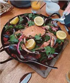  ??  ?? A thoroughly hearty lunch consisting of a variety of fresh local seafood at La Bimba in Apollo Bay.