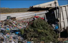  ?? ?? A garbage truck drops trash in Colmenar Viejo landfill Feb. 1 on the outskirts of Madrid.