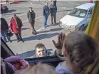  ?? ?? A father says goodbye to his wife and daughter through the window of a Team Humanity bus in Mykolaiv, Ukraine. The group has ventured closer to the frontlines than ever.