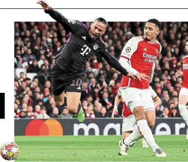  ?? — reuters ?? no repeat of that, please: arsenal’s William saliba fouls Bayern Munich’s leroy sane, resulting in a penalty in their Champions league quarter-final first leg match at the emirates on april 9.