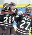  ?? CLIFFORD SKARSTEDT/EXAMINER ?? Peterborou­gh Petes' Chris Paquette celebrates his goal with teammates Jonathan Ang and Matt Spencer.