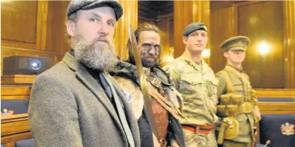  ?? Robert Melen ?? > From left: Artist Marc Rees, Jop Perou as a Celtic warrior, serving soldier Captain David Williams from Two Rifles and a WWI soldier played by Mathew Prichard at yesterday’s launch of Nawr yr Arwr/Now the Hero