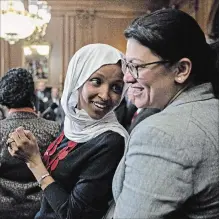  ?? ANDREW HARRER BLOOMBERG FILE PHOTO ?? Democrat Rep. Ilhan Omar, left, talks to Rep. Rashida Tlaib, during a news conference at the U.S. Capitol in Washington on March 13, 2019.