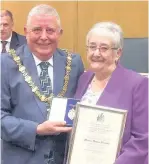  ??  ?? Former Mayor’s Janet Storey (left) and Marlene Haworth receive their Honorary Alderman title from current Mayor Coun Peter Britclifff­e.