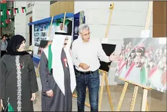  ?? KUNA photo ?? Director General of Kuwait National Library Kamel Al-Abd Al-Jalil during a tour of thephoto gallery.