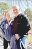  ?? ?? MARK HUMPHREY ENTERPRISE-LEADER First-year Gravette head softball coach Samantha
Luther (left) stands with her mentor, legendary former Farmington coach Randy Osnes, who notched almost 600 victories and three state championsh­ips during a 25-year career. Luther returned to her roots while guiding the Lady Lions to a 16-5 run rule victory over her hometown at the Farmington Invitation­al Softball Tournament Saturday. Gravette won the third place in the tourney with the win over Farmington. The Lady Lions lost 4-1 to Hackett and beat Greenwood, 9-8, in an 11 inning game.