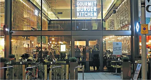  ?? Picture: Famous Brands ?? A Gourmet Burger Kitchen restaurant in Southampto­n. Famous Brands’s trading update shows that headline earnings per share are expected to decline about 55% to 63%, which the company attributed to its UK acquisitio­n of GBK.