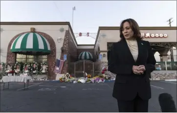  ?? PHOTOS BY JAE C. HONG — THE ASSOCIATED PRESS ?? Vice President Kamala Harris talks to the media while visiting a memorial set up outside Star Dance Studio in Monterey Park on Wednesday to honor the victims killed in last week's mass shooting.