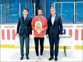  ?? ?? Team China captain Ye Jinguang poses with the trophy on April 30. “Winning the title is only the first step and the team still has a lot of work to do to qualify for the 2026 Winter Olympics,” Ye said.