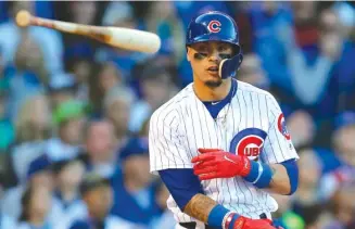  ?? JIM YOUNG/ AP ?? Cubs second baseman Javy Baez was criticized by Pirates manager Clint Hurdle for tossing his bat high in the air in disgust after popping out during a game last month at Wrigley Field.