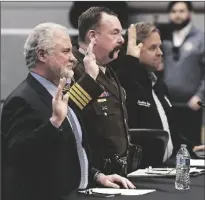  ?? ?? LEFT: Hearing witnesses (from left) Dr. Robert Trenchel, President and CEO of Yuma Regional Medical Center, Yuma County Sheriff Leon Wilmot and Jonathan Lines, Yuma County Board of Supervisor­s, District 2, take an oath prior to testifying before Thursday’s hearing committee.