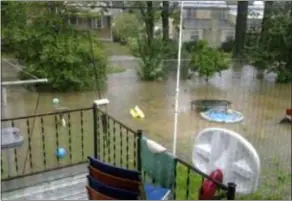  ?? SUBMITTED PHOTO ?? Jennifer Wilson took this photo of her back door in the Grace Park section of Ridley Township. She reports the water level is 3 feet.