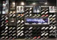  ??  ?? This Thursday, Aug. 25, 2016, photo, shows an elevated presentati­on of Converse Prime sneakers at Foot Locker’s redesigned Manhattan flagship store in New York. Foot Locker is reorganizi­ng its stores to further highlight top brands, designatin­g areas...