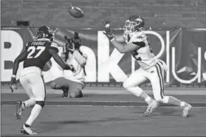  ?? THOMAS GRANING/AP ?? Arkansas tight end Hudson Henry, 82, catches a 12-yard touchdown pass during the second half of the team’s NCAA college football game against Mississipp­i State in Starkville, Mississipp­i, Saturday, Oct. 3, 2020. Arkansas won 21-14.