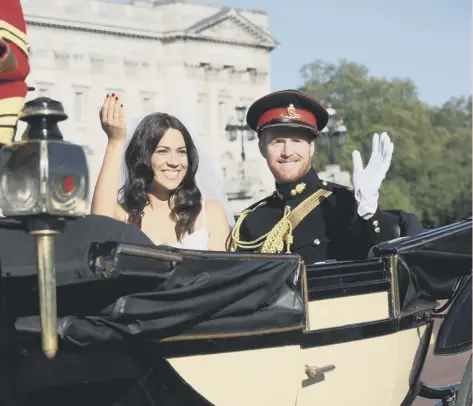  ?? PICTURE: MATT ALEXANDER/PA ?? 0 Inmaculada Santisteba­n Serran and Rhys Whittock get London in the royal wedding mood