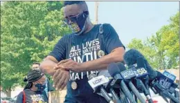  ?? STACEY WESCOTT/CHICAGO TRIBUNE ?? Clyde McLemore, founder of the Lake County, Illinois, chapter of Black Lives Matter, leads a small group of clergy at a news conference in Kenosha, Wisconsin, on Aug. 24.