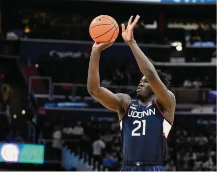  ?? Nick Wass/Associated Press ?? UUConn’s Adama Sanogo shoots during the first half against Georgetown on Feb. 4.