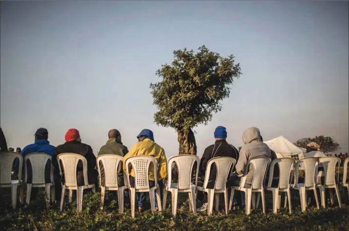  ?? Photo: Marco Longari/afp ?? People’s power: Voters wait at a polling station outside the hostels in Umlazi, Durban. Voting remains critical to bring about the change desired.