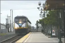  ?? BEA AHBECK/NEWS-SENTINEL ?? An Amtrak train arrives in Lodi on Friday.