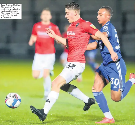  ??  ?? Tylor Golden of Salford City holds off a challenge from Layton Ndukwu of Leicester City Under-21s during an EFL Trophy match in December.