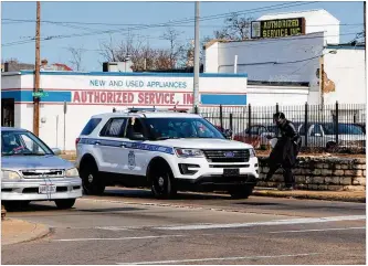  ?? CORNELIUS FROLIK / STAFF ?? Dayton police offifficer­s speakwith a panhandler at South Keowee Street andWayne Avenue. Panhandlin­g has declined in Dayton, even as other cities have seen a rise amid the pandemic.