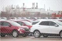  ??  ?? GENERAL MOTORS CAMI car assembly plant sits behind rows of new GMC Terrain and Chevrolet Equinox in Ingersoll, Ontario, Canada, Jan. 27.