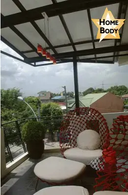  ??  ?? THE TERRACE is the home’s best feature and is adorned with Kenneth Cobonpue’s round lounge chairs with red latticewor­k.