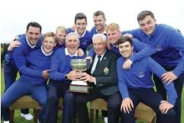  ??  ?? Thriller: GUI President John Moloughney presents the trophy to Michael Coote and the Munster team Picture: Fran Caffrey / Golffile.ie