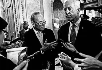  ?? SHAWN THEW/EPA ?? Democratic Sen. Chuck Schumer, left, and GOP Sen. John Cornyn voice their approval of the 97-1 Senate vote Wednesday.