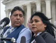  ?? ALEX BRANDON — THE ASSOCIATED PRESS FILE ?? Beatriz Gonzalez, right, the mother of 23-year-old Nohemi Gonzalez, a student killed in the Paris terrorist attacks, and stepfather Jose Hernandez, speak outside the Supreme Court, Feb. 21, in Washington. The Supreme Court on Thursday sidesteppe­d a case against Google that might have allowed more lawsuits against social media companies.