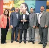  ?? —submitted photo ?? Father Richard Woodbury received a Medal from the National Assembly for his involvemen­t with the in Pointe-au-Chêne for 50 years.